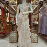 Off white tissue saree with brocade blouse