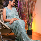 Mint green sequin saree with readymade sequin blouse.