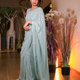 Mint green sequin saree with readymade sequin blouse.