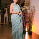 Mint green sequin saree with readymade sequin blouse.