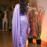 Lavender sequin saree with sequin readymade blouse.