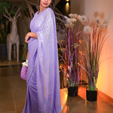 Lavender sequin saree with sequin readymade blouse.