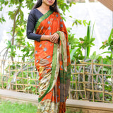 Brick semi tussar saree with contrast attached blouse.