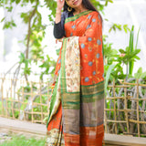 Brick semi tussar saree with contrast attached blouse.