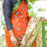 Brick semi tussar saree with contrast attached blouse.