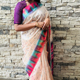 Semi tussar saree with contrast pink unstitched blouse.