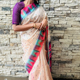 Semi tussar saree with contrast pink unstitched blouse.