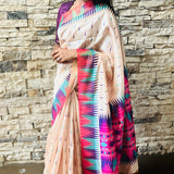 Semi tussar saree with contrast pink unstitched blouse.