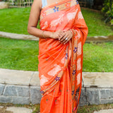 Orange semi tussar saree with unstitched printed blouse