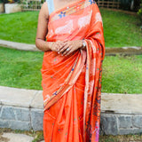 Orange semi tussar saree with unstitched printed blouse